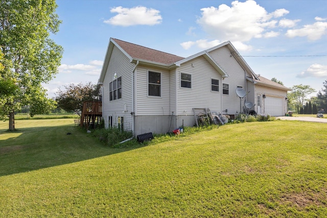 8078 S Royston Rd, Eaton Rapids, MI 48827 - view of home's exterior featuring an attached garage, a yard, concrete driveway, and a wooden deck