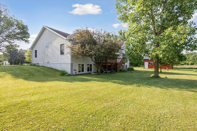 8078 S Royston Rd, Eaton Rapids, MI 48827 - view of green lawn with a deck