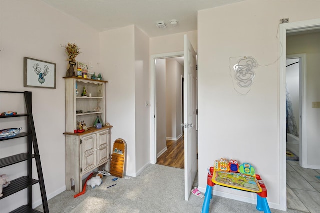 8078 S Royston Rd, Eaton Rapids, MI 48827 - playroom featuring baseboards and light carpet