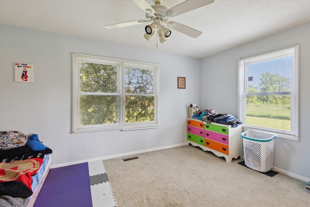 8078 S Royston Rd, Eaton Rapids, MI 48827 - game room featuring a ceiling fan and carpet flooring