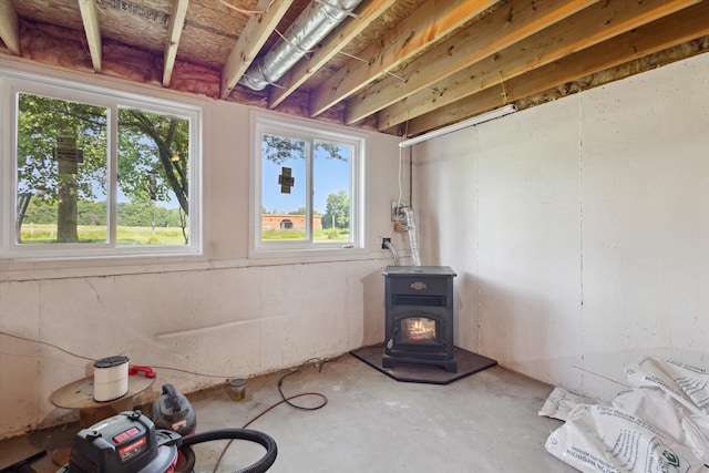 8078 S Royston Rd, Eaton Rapids, MI 48827 - below grade area with a wood stove and plenty of natural light
