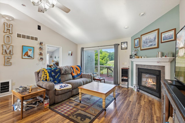 8078 S Royston Rd, Eaton Rapids, MI 48827 - living area featuring vaulted ceiling, wood finished floors, a fireplace, and ceiling fan