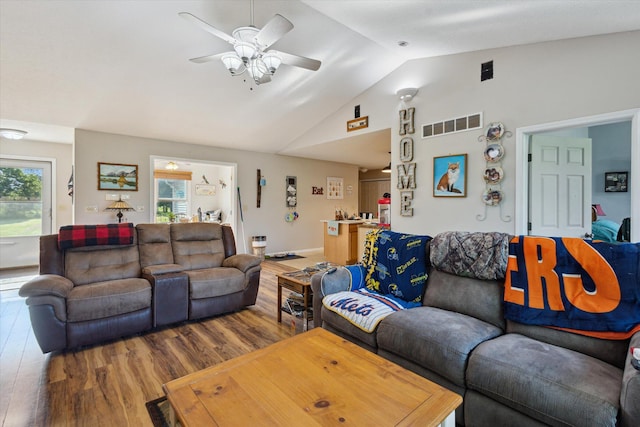 8078 S Royston Rd, Eaton Rapids, MI 48827 - living room featuring lofted ceiling, wood finished floors, healthy amount of natural light, and a ceiling fan