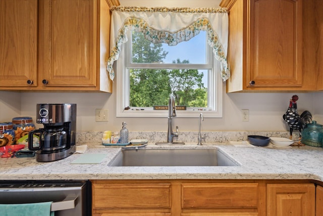 8078 S Royston Rd, Eaton Rapids, MI 48827 - kitchen featuring dishwasher, light stone counters, and brown cabinets