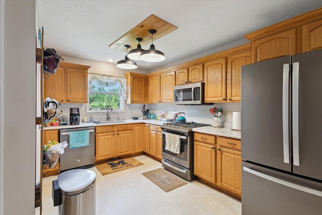 8078 S Royston Rd, Eaton Rapids, MI 48827 - kitchen featuring stainless steel appliances, light countertops, and decorative light fixtures