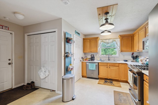 8078 S Royston Rd, Eaton Rapids, MI 48827 - kitchen featuring appliances with stainless steel finishes and light countertops