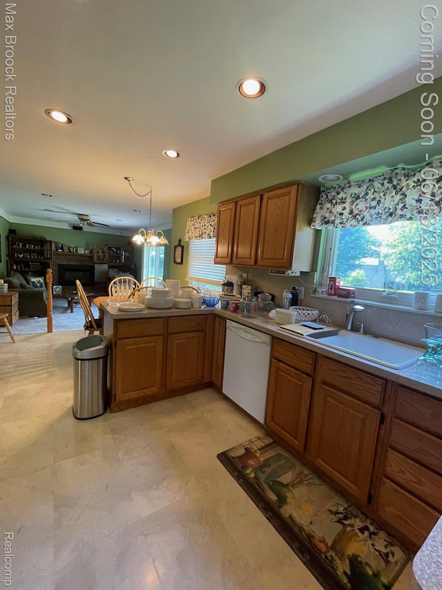 2669 Willard Dr, Troy, MI 48085 - kitchen featuring white dishwasher, plenty of natural light, a peninsula, recessed lighting, and decorative light fixtures