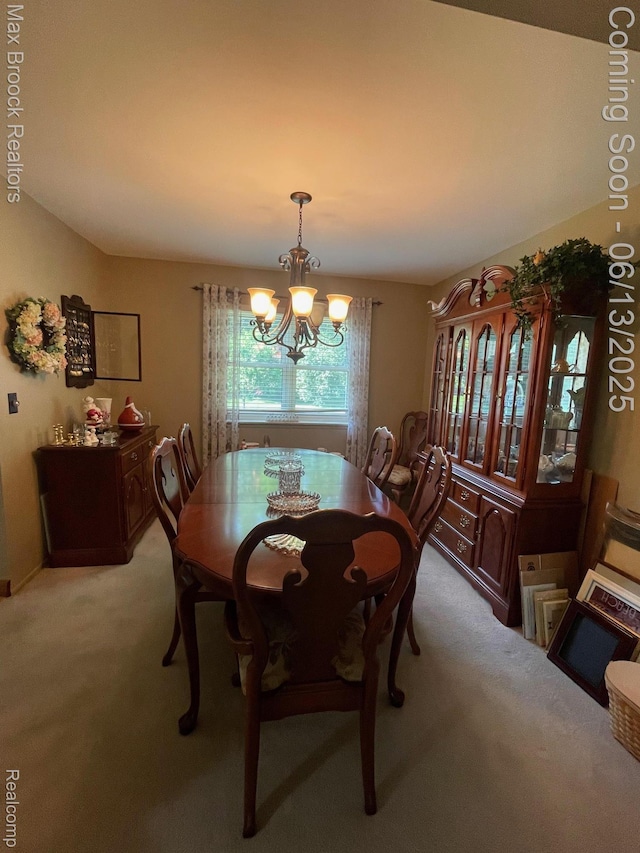 2669 Willard Dr, Troy, MI 48085 - dining area featuring a chandelier and light colored carpet