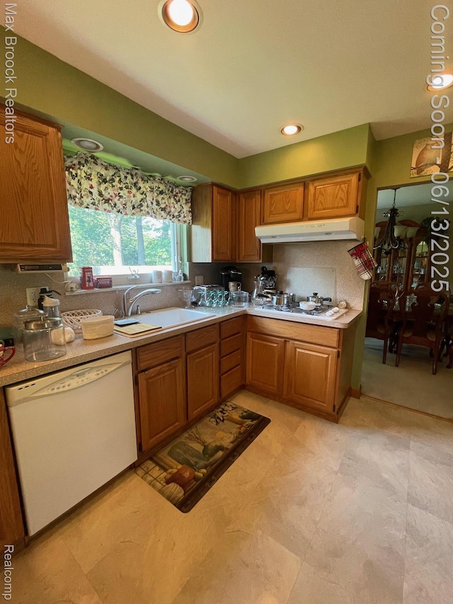 2669 Willard Dr, Troy, MI 48085 - kitchen featuring white appliances, under cabinet range hood, brown cabinets, and light countertops