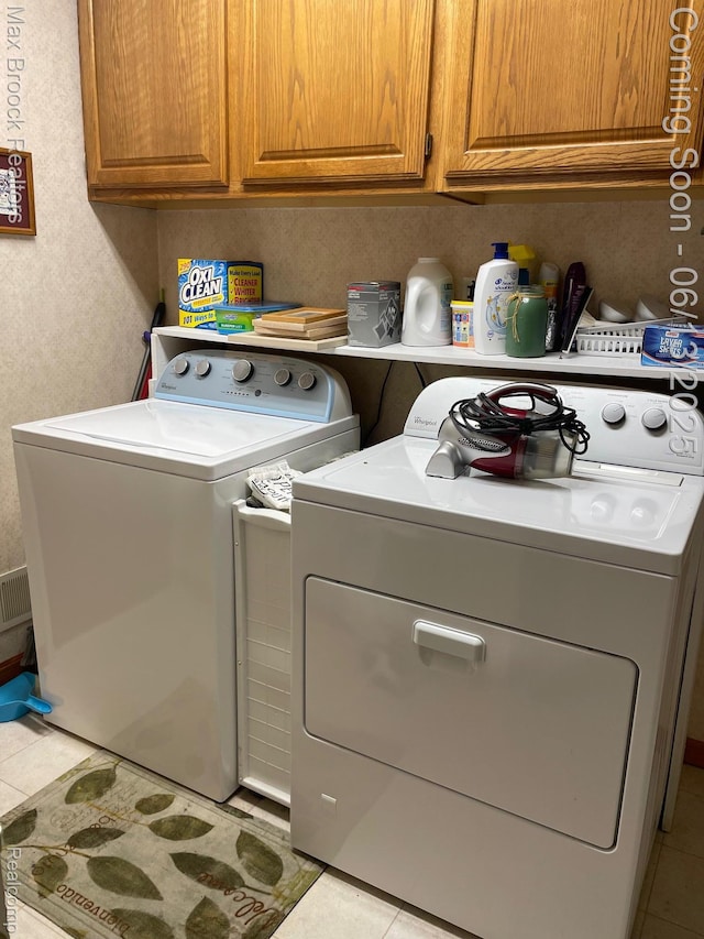 2669 Willard Dr, Troy, MI 48085 - laundry room featuring light tile patterned floors, cabinet space, and washer and dryer