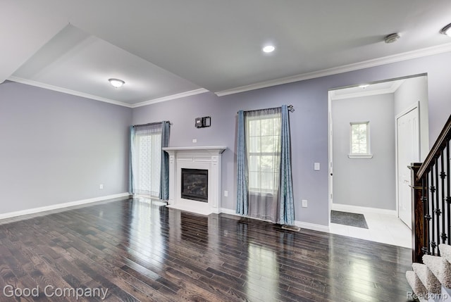 1724 Barrington Ct, Lake Orion, MI 48360 - unfurnished living room featuring stairway, wood finished floors, crown molding, and a glass covered fireplace