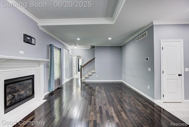 1724 Barrington Ct, Lake Orion, MI 48360 - unfurnished living room with crown molding, wood finished floors, stairway, recessed lighting, and a glass covered fireplace