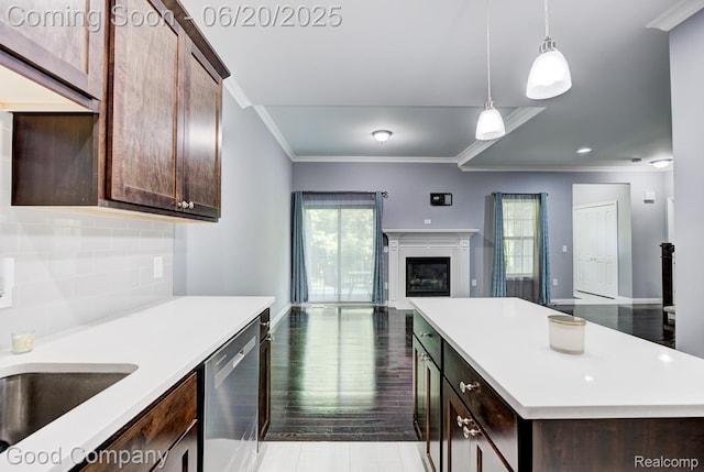 1724 Barrington Ct, Lake Orion, MI 48360 - kitchen with dishwasher, open floor plan, ornamental molding, light countertops, and a fireplace