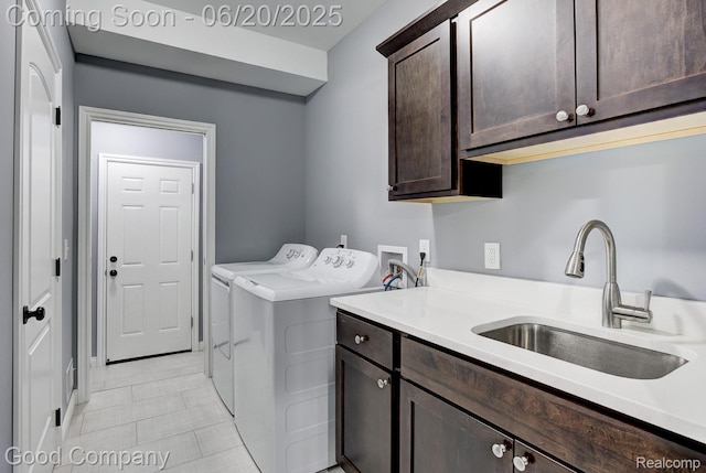 1724 Barrington Ct, Lake Orion, MI 48360 - laundry area with cabinet space, separate washer and dryer, and light tile patterned flooring