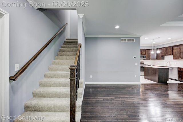 1724 Barrington Ct, Lake Orion, MI 48360 - staircase with crown molding, wood finished floors, and recessed lighting