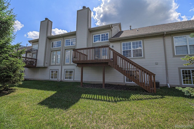 5891 Augusta Ln, Grand Blanc, MI 48439 - rear view of property with stairs, a yard, and a deck