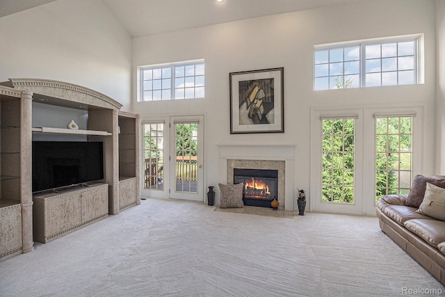 5891 Augusta Ln, Grand Blanc, MI 48439 - carpeted living area with a fireplace with flush hearth and a high ceiling