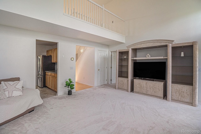 5891 Augusta Ln, Grand Blanc, MI 48439 - living room featuring a towering ceiling and light colored carpet