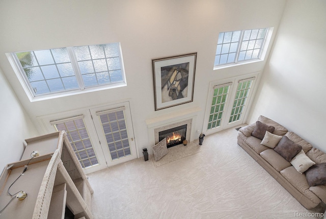 5891 Augusta Ln, Grand Blanc, MI 48439 - carpeted living room featuring a towering ceiling and a fireplace