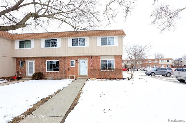 410 Riverbend Dr, Milan, MI 48160 - townhome / multi-family property with brick siding and entry steps