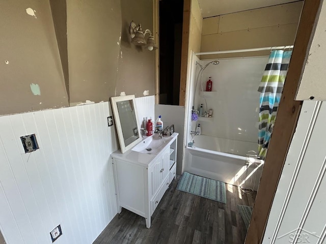 4764 9 Mile Rd, Pinconning, MI 48650 - bathroom featuring vanity, wood finished floors, and shower / bathtub combination with curtain