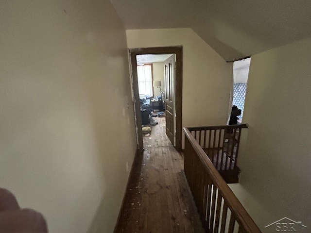 4764 9 Mile Rd, Pinconning, MI 48650 - corridor featuring an upstairs landing, vaulted ceiling, and wood finished floors