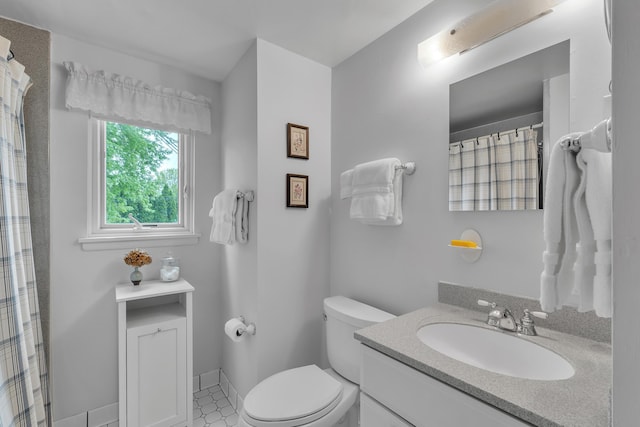 3622 Cushing Ct, Dexter, MI 48130 - full bathroom with vanity, toilet, and a shower with shower curtain