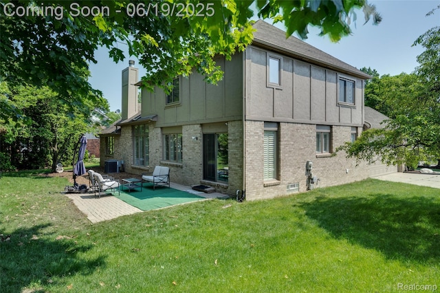 30753 Sunderland Dr, Farmington Hills, MI 48331 - rear view of property with board and batten siding, brick siding, a yard, and a chimney