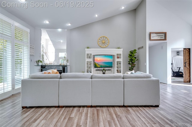 30753 Sunderland Dr, Farmington Hills, MI 48331 - living area featuring light wood-style flooring, recessed lighting, and high vaulted ceiling
