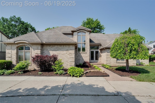 30753 Sunderland Dr, Farmington Hills, MI 48331 - view of front of home with brick siding and a shingled roof