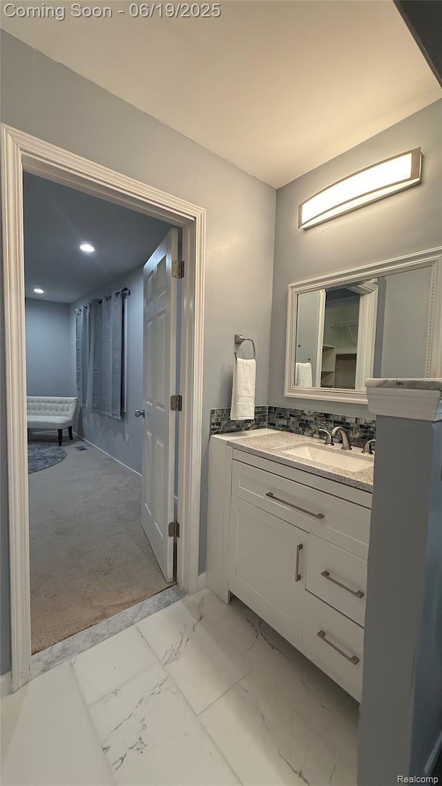 30753 Sunderland Dr, Farmington Hills, MI 48331 - bathroom featuring marble finish floors, vanity, and recessed lighting