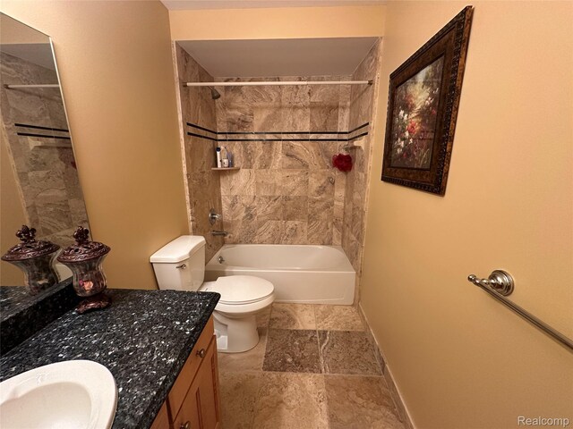 6601PEMBRIDGEHILL Pembridge Hl, West Bloomfield, MI 48322 - full bath featuring vanity, washtub / shower combination, toilet, stone finish floors, and baseboards