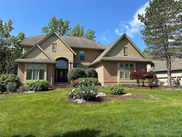 6601PEMBRIDGEHILL Pembridge Hl, West Bloomfield, MI 48322 - view of front of house with brick siding, a front yard, and a shingled roof