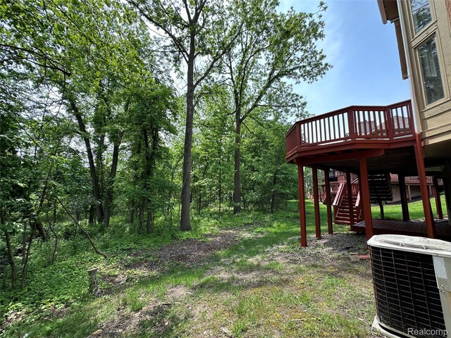 6601PEMBRIDGEHILL Pembridge Hl, West Bloomfield, MI 48322 - view of yard with central air condition unit, a wooden deck, and stairway