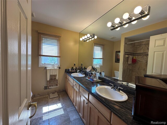 6601PEMBRIDGEHILL Pembridge Hl, West Bloomfield, MI 48322 - full bathroom with toilet, healthy amount of natural light, double vanity, and a shower