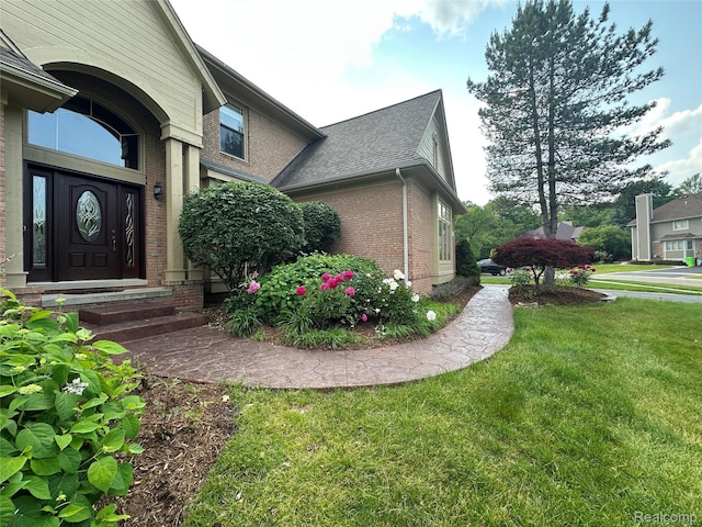 6601PEMBRIDGEHILL Pembridge Hl, West Bloomfield, MI 48322 - view of home's exterior with brick siding and a yard