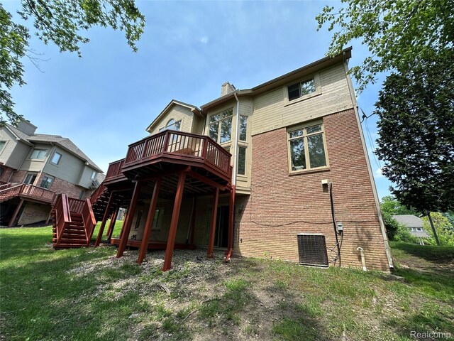 6601PEMBRIDGEHILL Pembridge Hl, West Bloomfield, MI 48322 - back of property featuring a wooden deck, stairs, a chimney, central AC, and a lawn