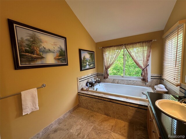 6601PEMBRIDGEHILL Pembridge Hl, West Bloomfield, MI 48322 - bathroom with lofted ceiling, a bath, vanity, and baseboards