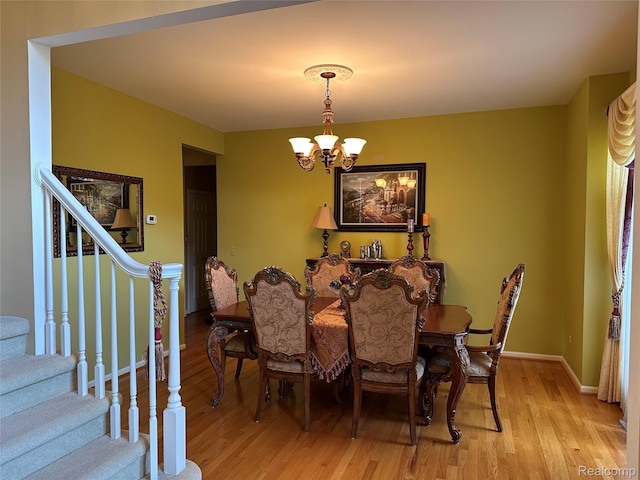 6601PEMBRIDGEHILL Pembridge Hl, West Bloomfield, MI 48322 - dining room featuring a chandelier, wood finished floors, stairs, and baseboards