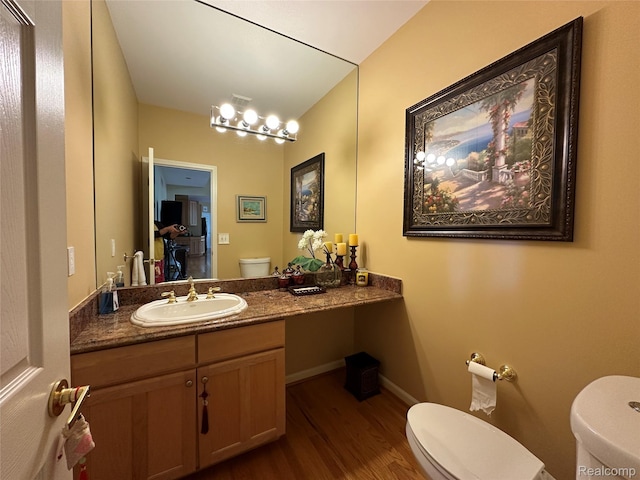 6601PEMBRIDGEHILL Pembridge Hl, West Bloomfield, MI 48322 - bathroom featuring toilet, wood finished floors, vanity, and baseboards