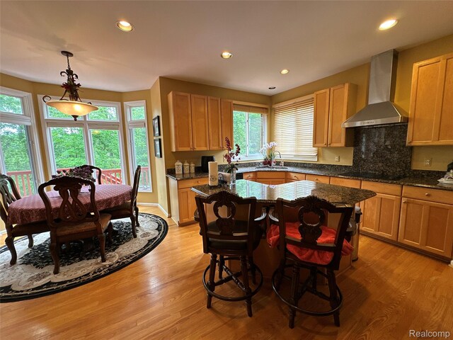 6601PEMBRIDGEHILL Pembridge Hl, West Bloomfield, MI 48322 - kitchen featuring wall chimney exhaust hood, black electric stovetop, light wood-style floors, recessed lighting, and a sink