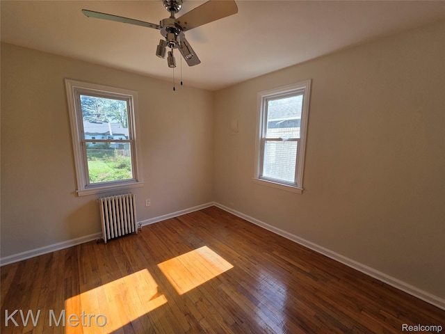 19620 Jeanette St, Southfield, MI 48075 - empty room with radiator heating unit, ceiling fan, baseboards, and wood finished floors