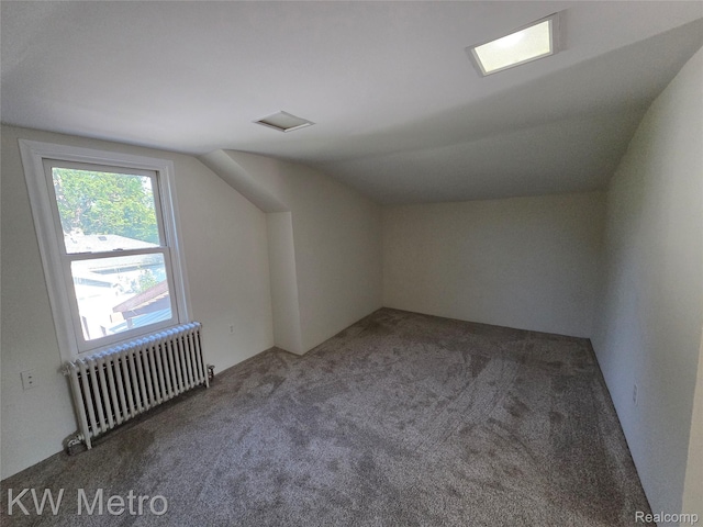 19620 Jeanette St, Southfield, MI 48075 - bonus room featuring radiator, vaulted ceiling, and carpet flooring