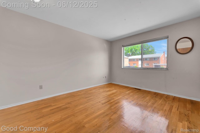 29628 Hoover Rd, Warren, MI 48093 - empty room featuring wood finished floors and baseboards