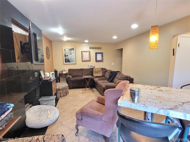 17137 Hilton St, Southfield, MI 48075 - living area with recessed lighting and light tile patterned floors