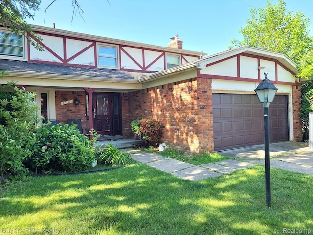 17137 Hilton St, Southfield, MI 48075 - tudor-style house with a front lawn, brick siding, a garage, and a chimney