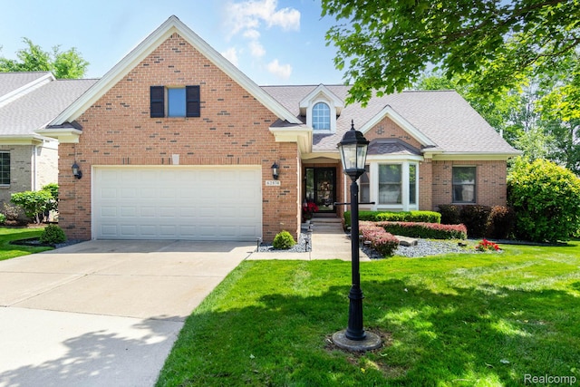 62874 Walker Ct Unit 17, Washington, MI 48094 - view of front of house with an attached garage, a front lawn, driveway, and brick siding