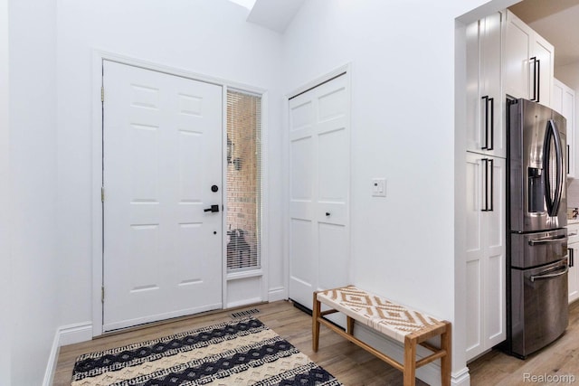 62874 Walker Ct Unit 17, Washington, MI 48094 - entryway featuring light wood finished floors and baseboards