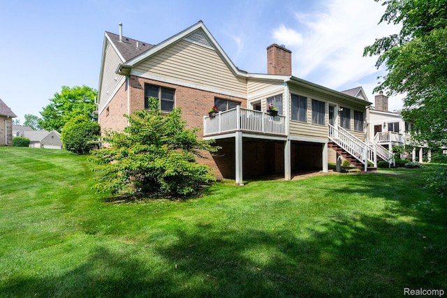 62874 Walker Ct Unit 17, Washington, MI 48094 - rear view of property featuring a chimney, a sunroom, a yard, brick siding, and stairs