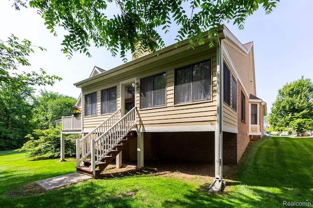 62874 Walker Ct Unit 17, Washington, MI 48094 - view of front of property featuring a front lawn, stairs, and a chimney